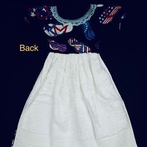 Red white and blue design on dress shaped hand towel.